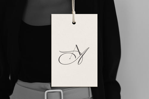 Reverie monogram debossed on a luxury hanging brand tag