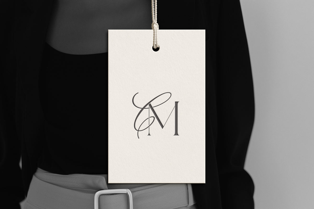 CM Reverie monogram on debossed hang tag