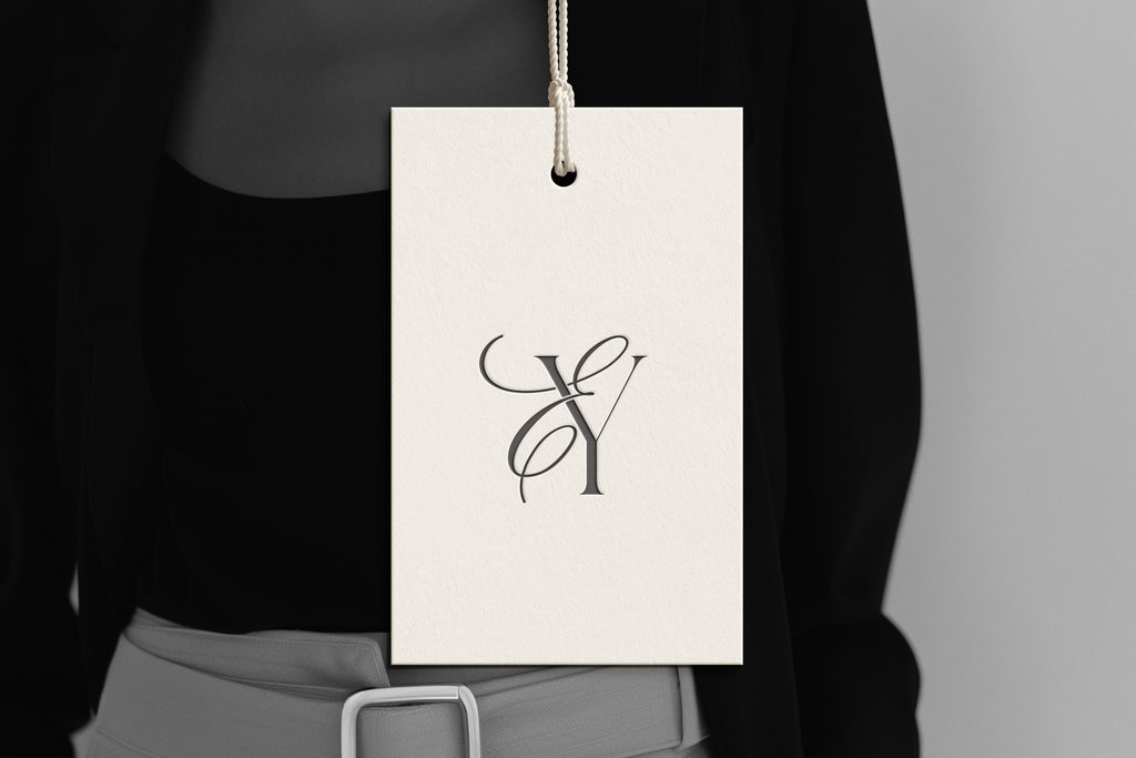 EY Reverie monogram on debossed hang tag