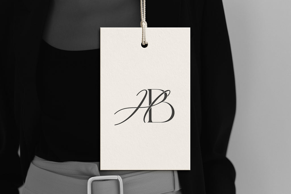 HB Reverie monogram on debossed hang tag