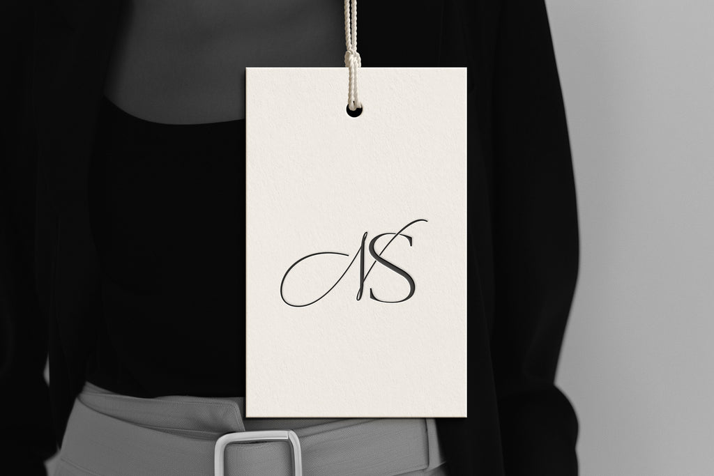 NS Reverie monogram on debossed hang tag