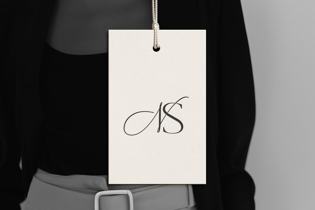 NS Reverie monogram on debossed hang tag